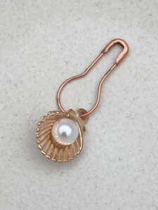 Golden shell with pearl